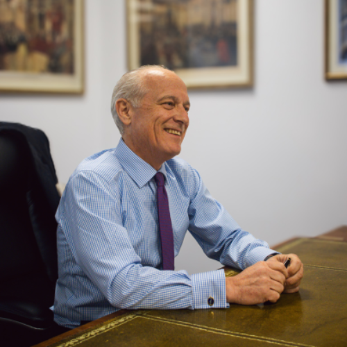 John Lumley sat at a desk